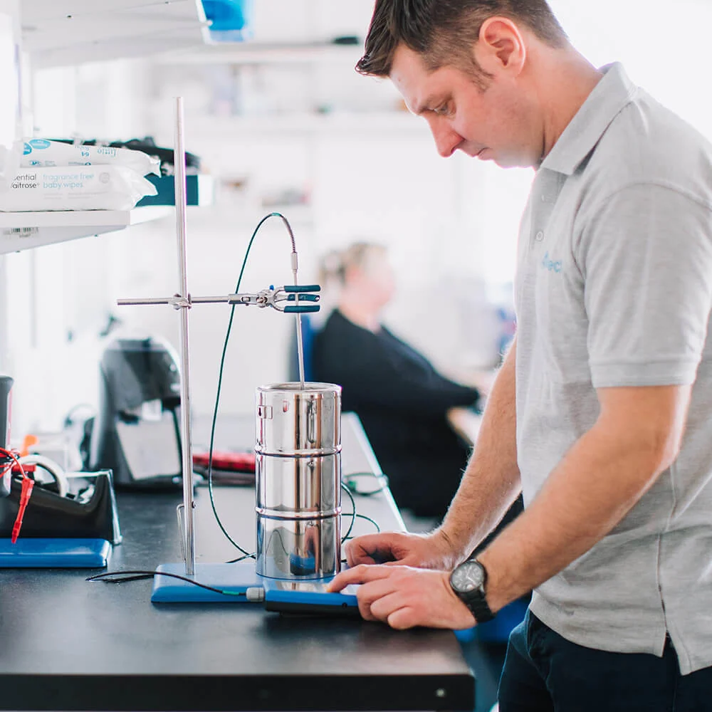 Intech Calibration technician working with precision equipment in the laboratory