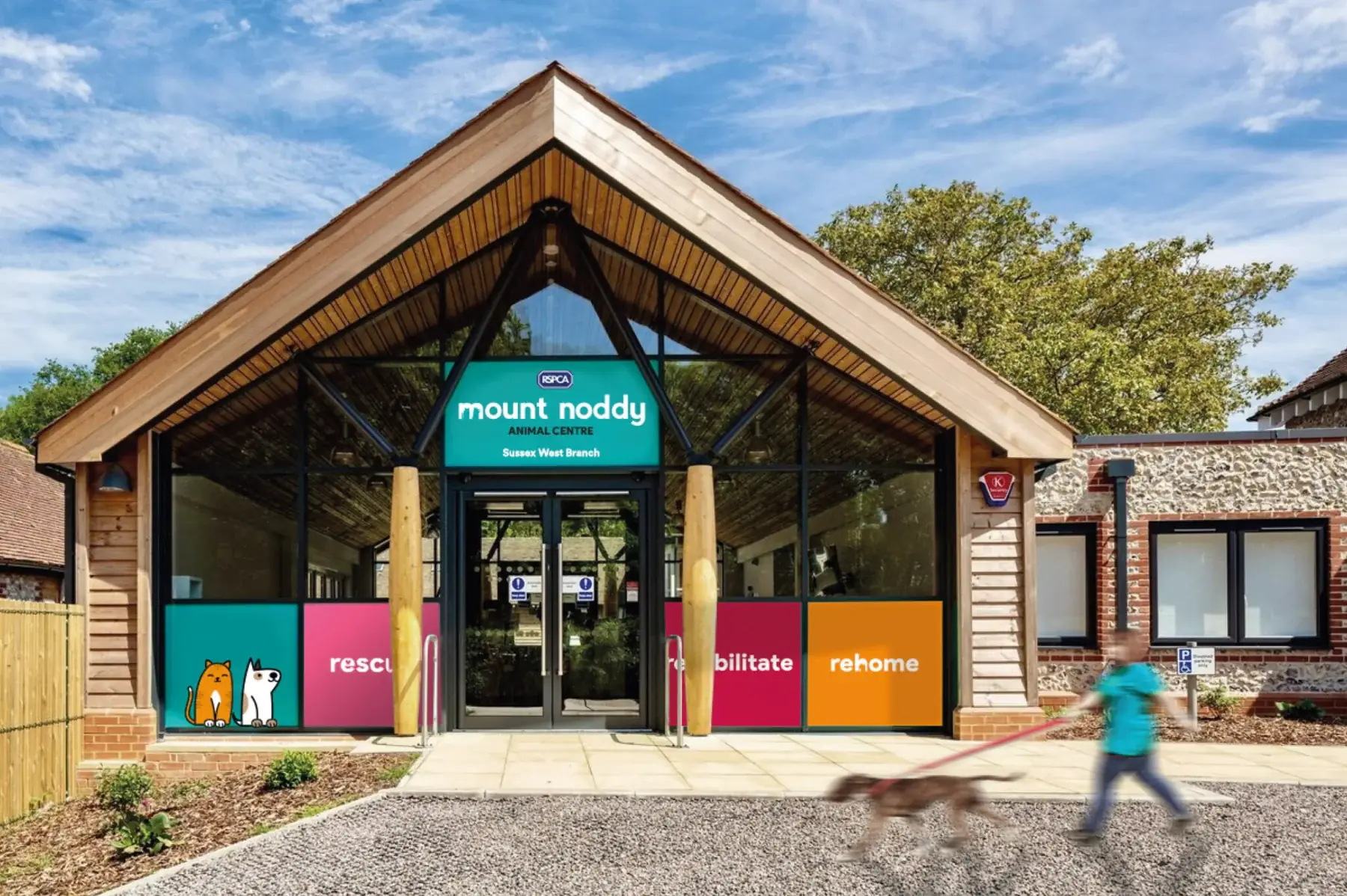 Mount Noddy Animal Centre entrance with turquoise signage and colourful branded window panels
